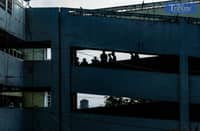 RESIDENTS in Tenement hanging out in its top floors.