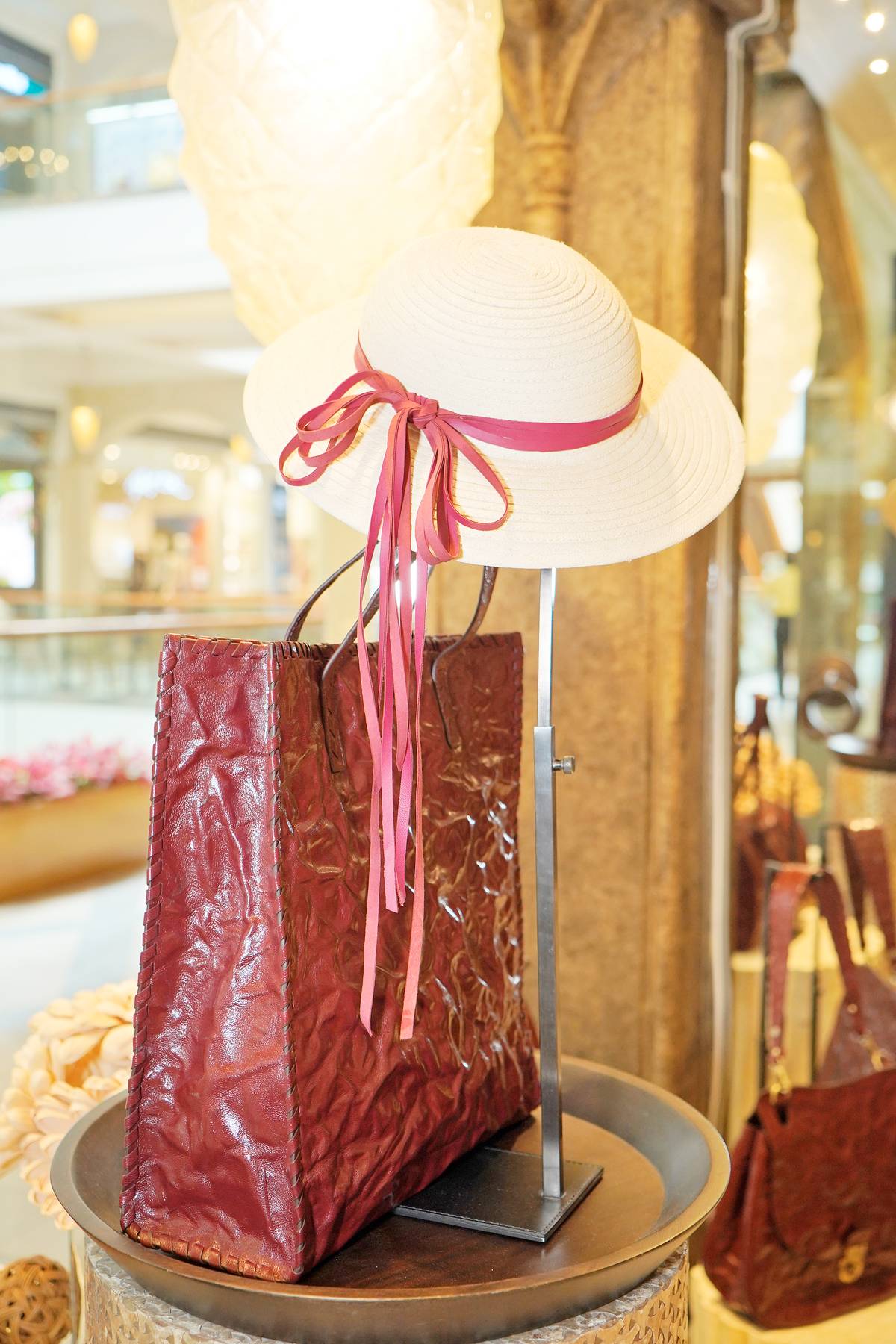 Artisan Mono Wrapped Tote in Red and Raffia Pith Hat.
