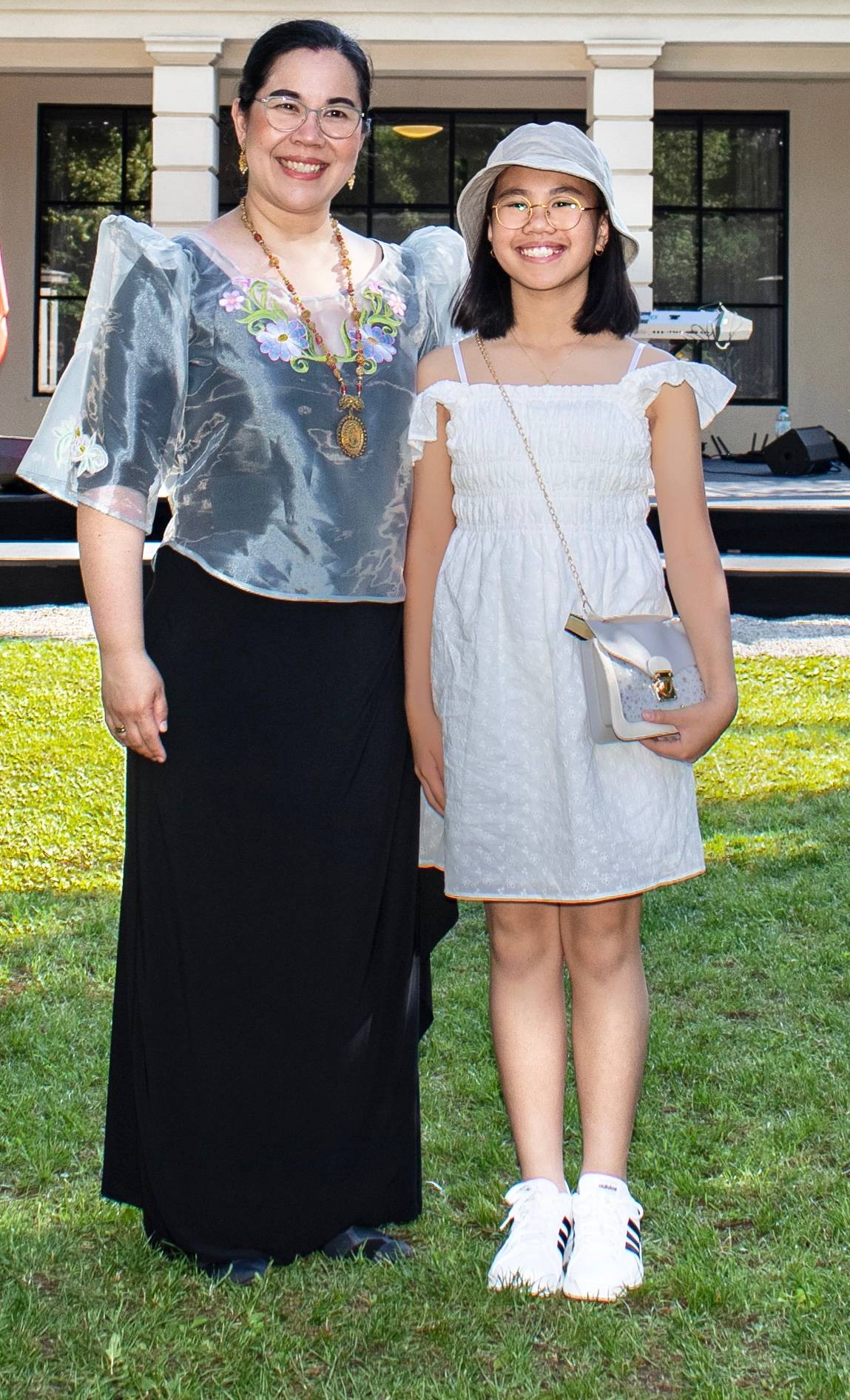 Minette Padilla Caces, former soprano and the embassy’s cultural assistant, and daughter Clara.
