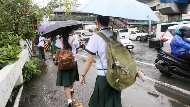 (JULY 3, 2025) Students of Ramon Magsaysay High School in Cubao, Quezon City seen headed home after the Quezon City LGU announce the suspension of classes in the afternoon due to the bad weather, PAGASA said A Low Pressure area LPA inside the Philippine Area of Responsibility (PAR) has a "MEDIUM" potential to develop into a tropical depression within the next 24 hours. on Thursday July 3 2025. Photo/Analy Labor