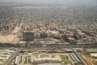 A general view shows buildings as pictured from the window of a commercial aircraft flying over Kabul on June 21, 2025.