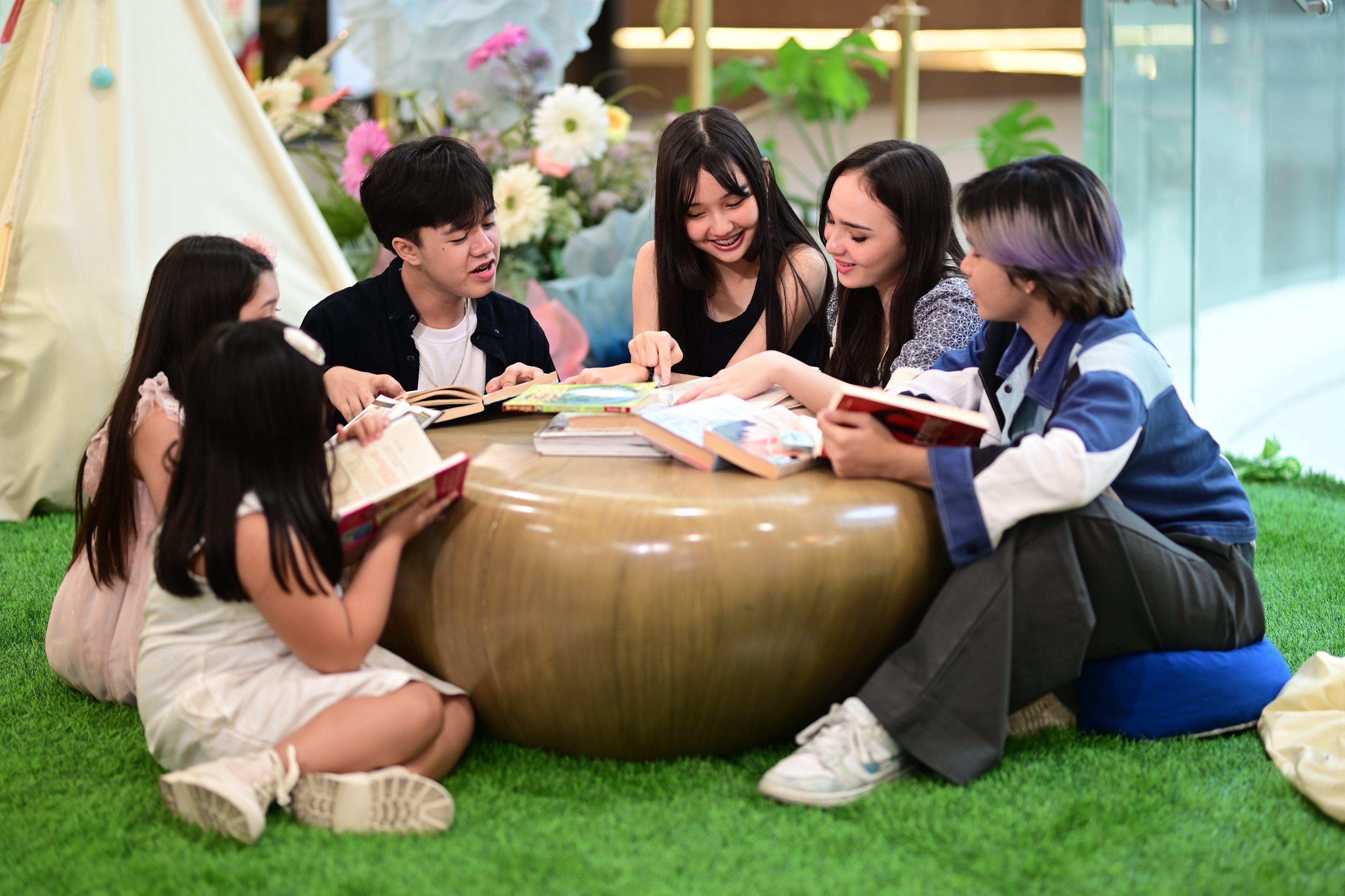 A group of friends dives into their favorite reads at the SM Book Nook—where every page turns into a shared adventure.