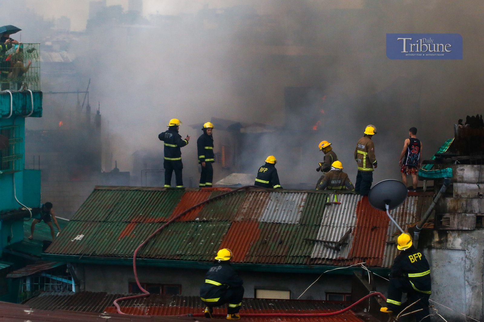 Firefighters respond to a fourth-alarm blaze in Barangay Addition Hills, Mandaluyong City, on 5 July 2025 — the third fire incident to hit Metro Manila between Friday night and Saturday morning.