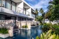 The resort features low-rise accommodations sustainably built using local materials from Bohol.