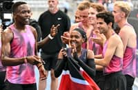 Kenya's Faith Kipyegon (C) reacts at the end of her race after taking part in the "Breaking4" event, in an attempt to become the first woman to run a mile in under four minutes, at Stade Charlety on June 26, 2025 in Paris. Triple Olympic champion Faith Kipyegon of Kenya fell well short in her bid to become the first woman to run a sub-four minute mile on June 26. Aided by wavelength technology and 13 pacers, 11 male and two women, Kipyegon clocked 4min 06.42sec over 1.6km in perfect conditions.