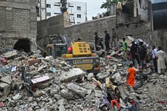 Search continues after Pakistan building collapse kills 14