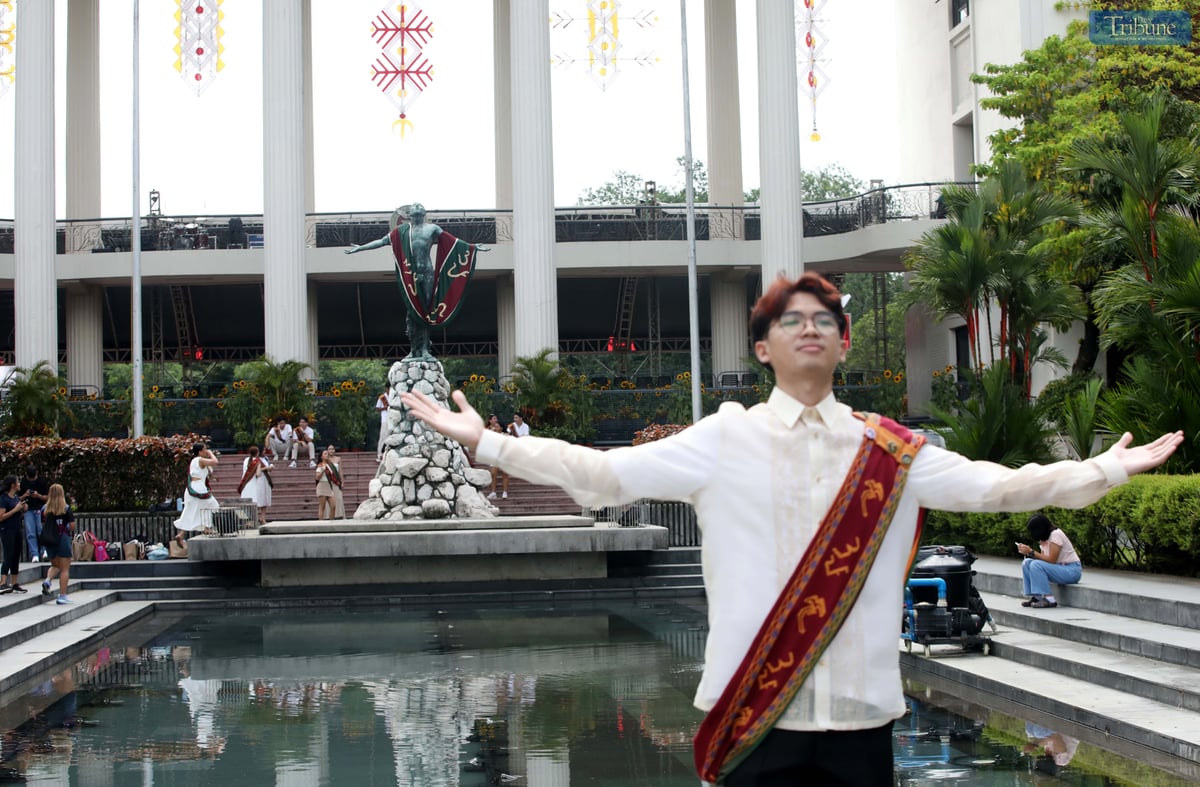 Graduates at the University of the Philippines Diliman in Quezon City pose for photos and selfies at the Oblation wearing the UP Sablay, the university’s official academic costume, on Saturday, 5 July 2025.