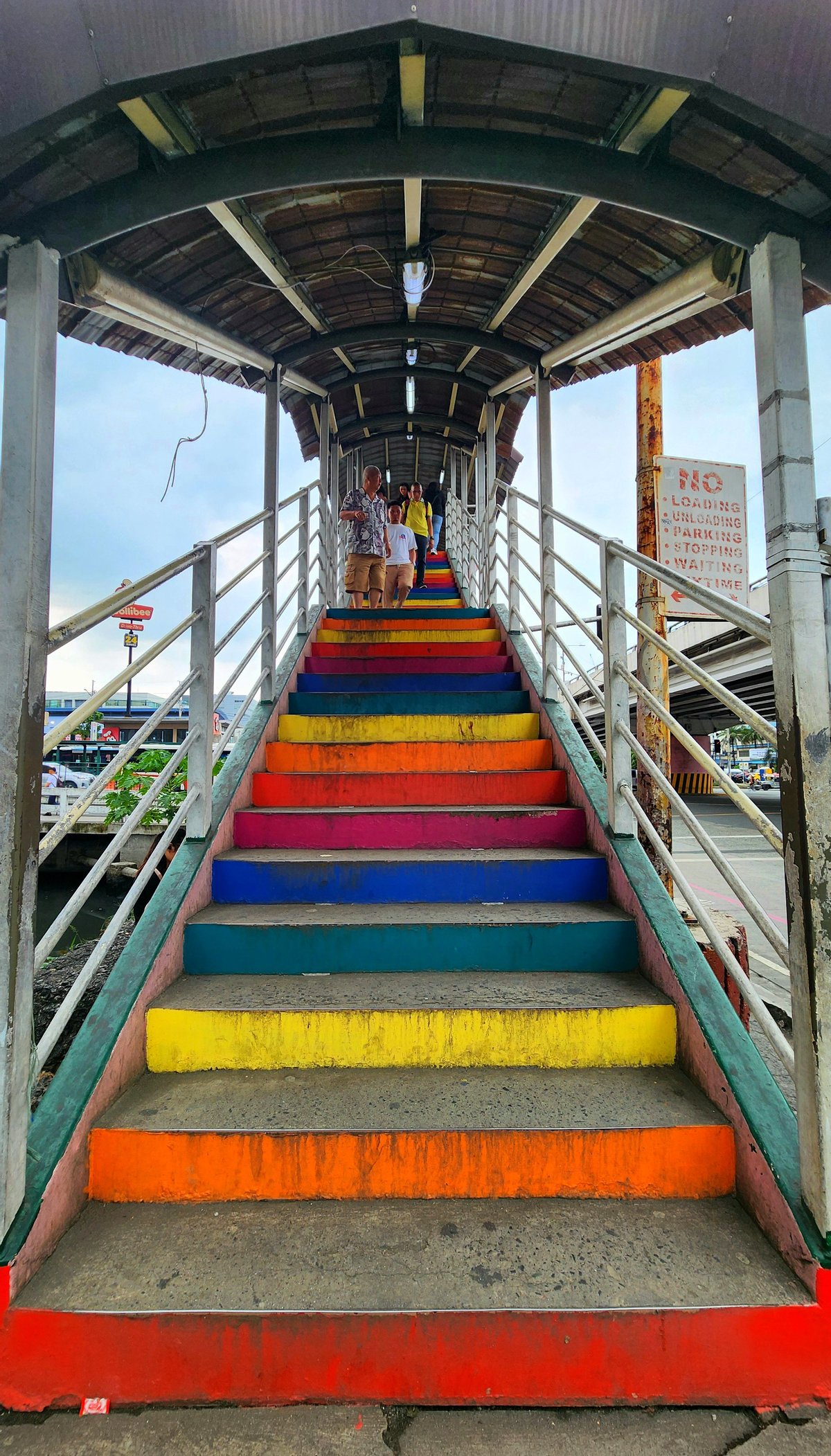 Multi-colored stairs of the EDSA Extension-Roxas Boulevard pedestrian footbridge.