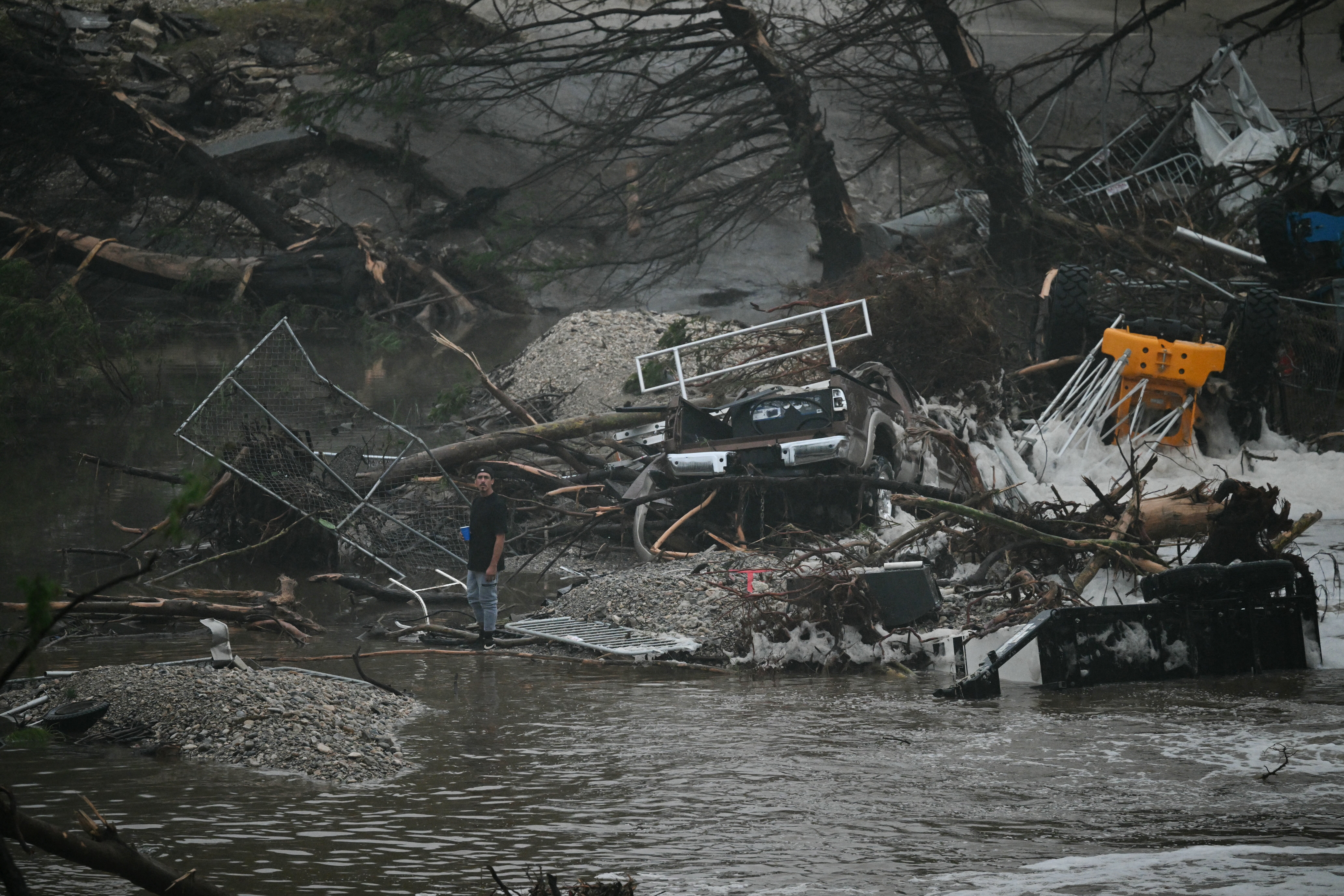Inundated Twisted metal, broken trees and a house gutted by the Guadalupe River’s rage — remnants of Mother Nature’s sudden fury — lie scattered in Center Point, Texas, on Saturday, after flash floods surged through Kerrville, killing dozens in a summer camp.