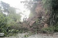 PERSONNEL from the Department of Public Works and Highways-Kalinga are deployed to clear the Calanan-Pinukpuk-Abbut Road near the Kalinga-Mountain Province boundary after heavy rains from the southwest monsoon triggered soil and rock erosion.