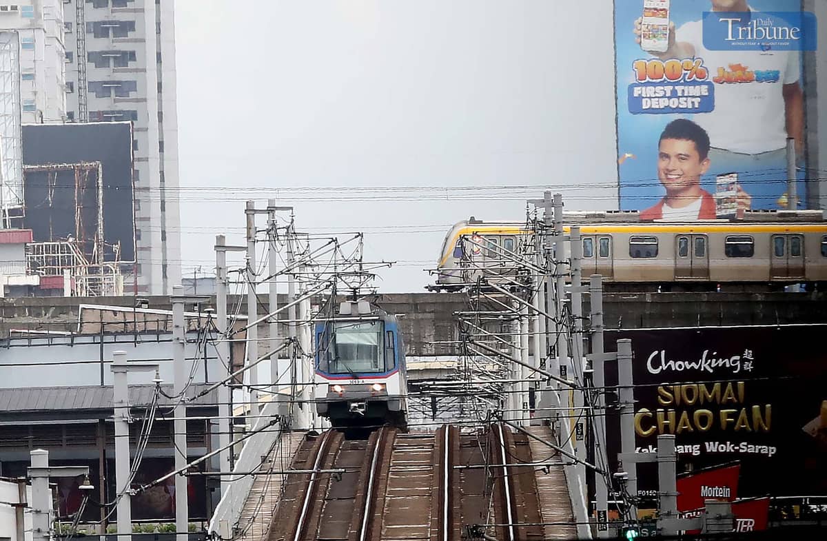 (July, 07 2025) An Metro Rail Transit (MRT3) and Light Rail Transit (LRT2) seen runs at the tracks in Cubao Quezon City on Monday July 7 2024. The dedicated lanes for students discounted tickets at the Metro Rail Transit Line 3 (MRT-3) and Light Rail Transit Line 2 (LRT-2) are now accessible, they have  to present their ID card or school registration form and write their names on a registry to get a 50-percent discount on single journey tickets. Transportation Secretary Vince Dizon said, Discounted train tickets will be available for all students until the Marcos administration ends in 2028. Photo/Analy Labor