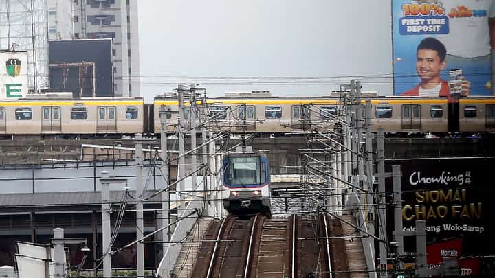 (July, 07 2025) An Metro Rail Transit (MRT3) and Light Rail Transit (LRT2) seen runs at the tracks in Cubao Quezon City on Monday July 7 2024. The dedicated lanes for students discounted tickets at the Metro Rail Transit Line 3 (MRT-3) and Light Rail Transit Line 2 (LRT-2) are now accessible, they have to present their ID card or school registration form and write their names on a registry to get a 50-percent discount on single journey tickets. Transportation Secretary Vince Dizon said, Discounted train tickets will be available for all students until the Marcos administration ends in 2028. Photo/Analy Labor