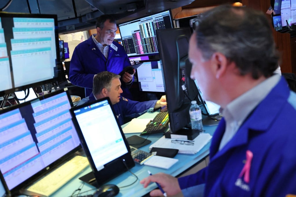 Global stocks mostly up despite new Trump tariffs, Nasdaq at record