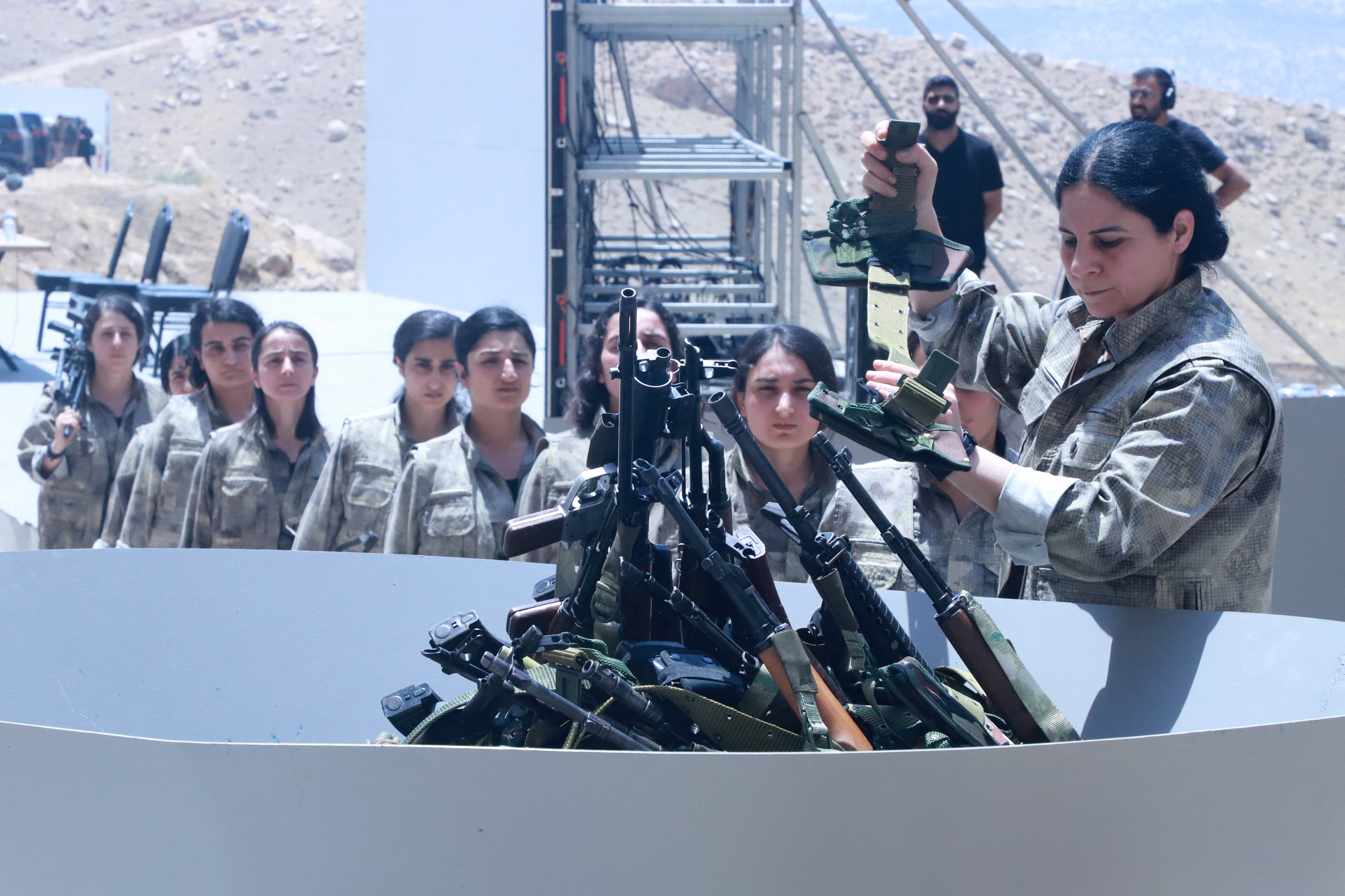 Kurdish PKK fighters destroy weapons