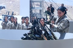 Kurdish PKK fighters destroy weapons