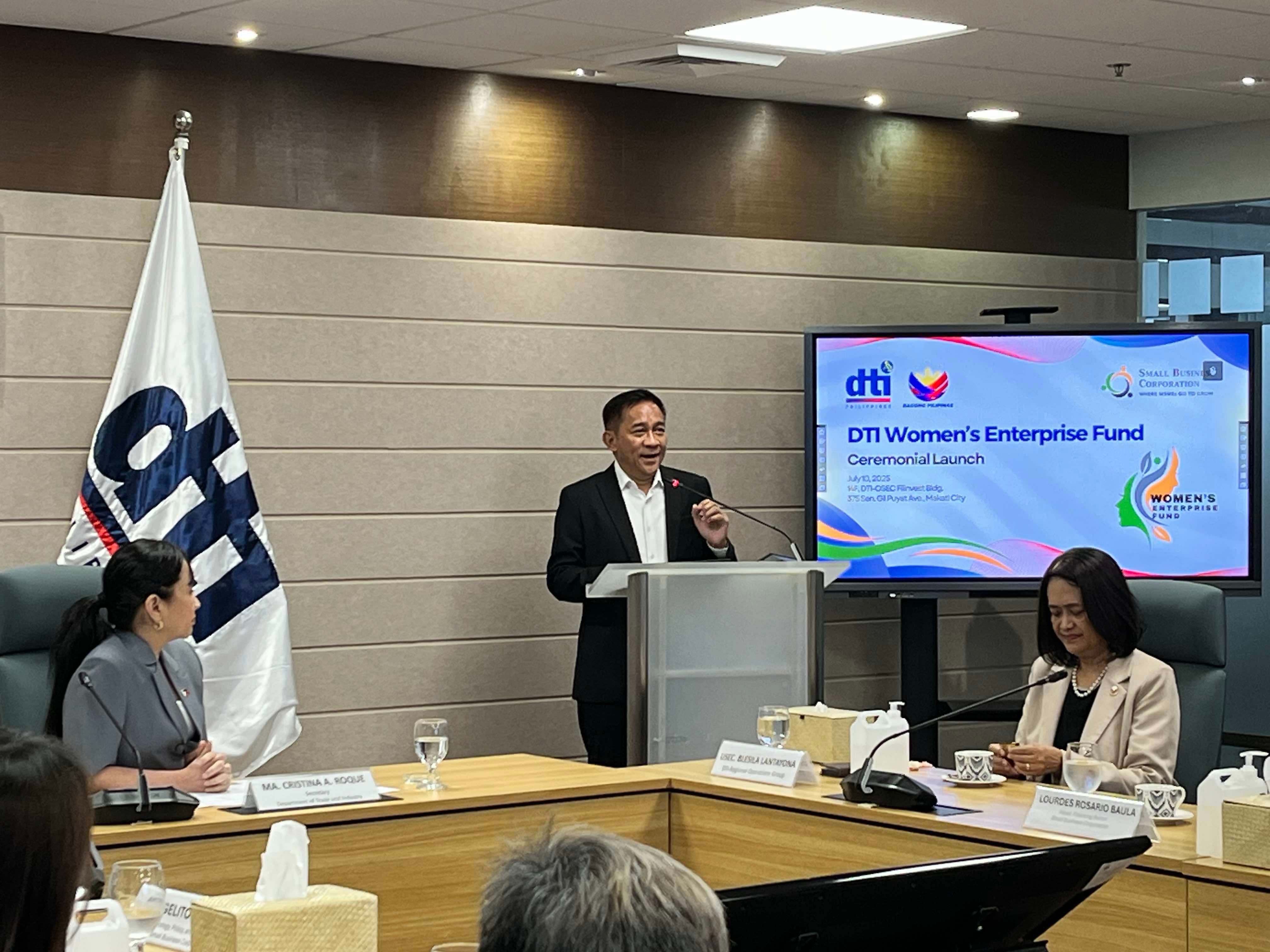 Small Business Corporation president and CEO Robert Bastillo discusses how women entrepreneurs can avail of the Women's Enterprise Fund program, a soft loan specifically meant for them. Trade Secretary Cris Roque (left) listens while Bastillo is discussing the loan program during its formal launch on Thursday at the DTI office in Makati City.