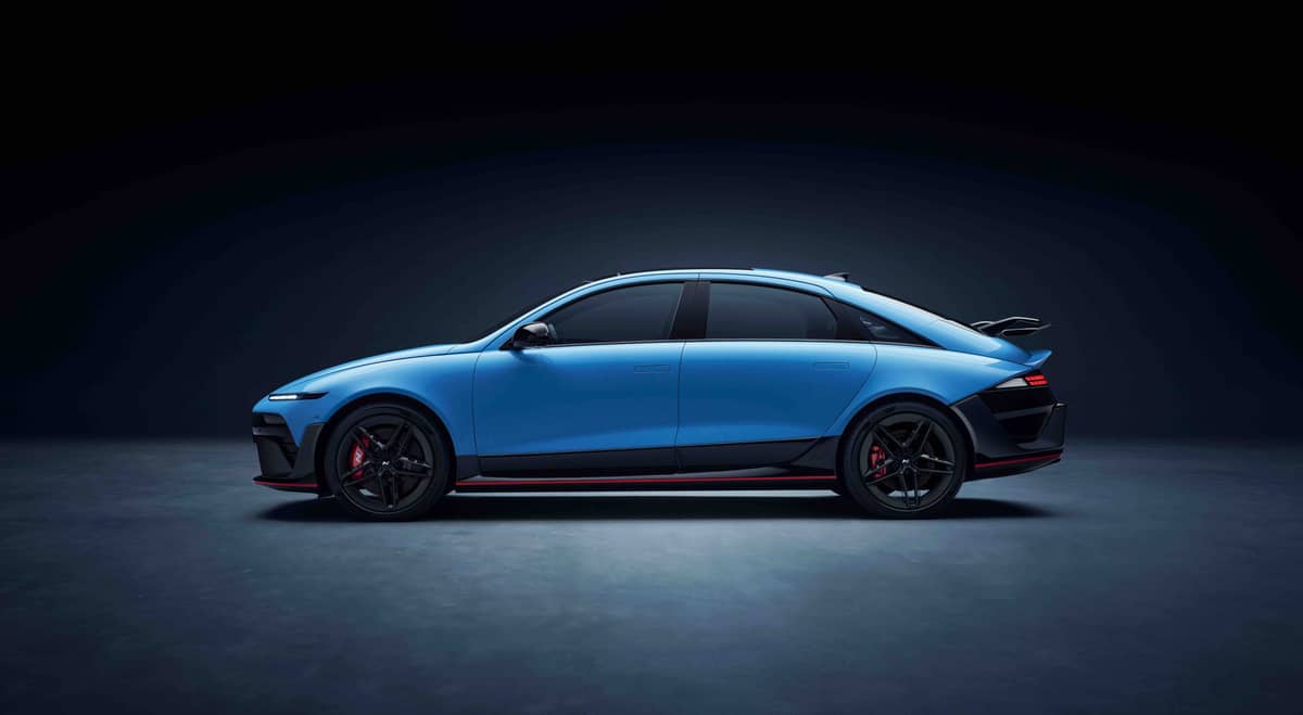 The Hyundai IONIQ 6 N stands low and wide with a sporty silhouette and bold stance.