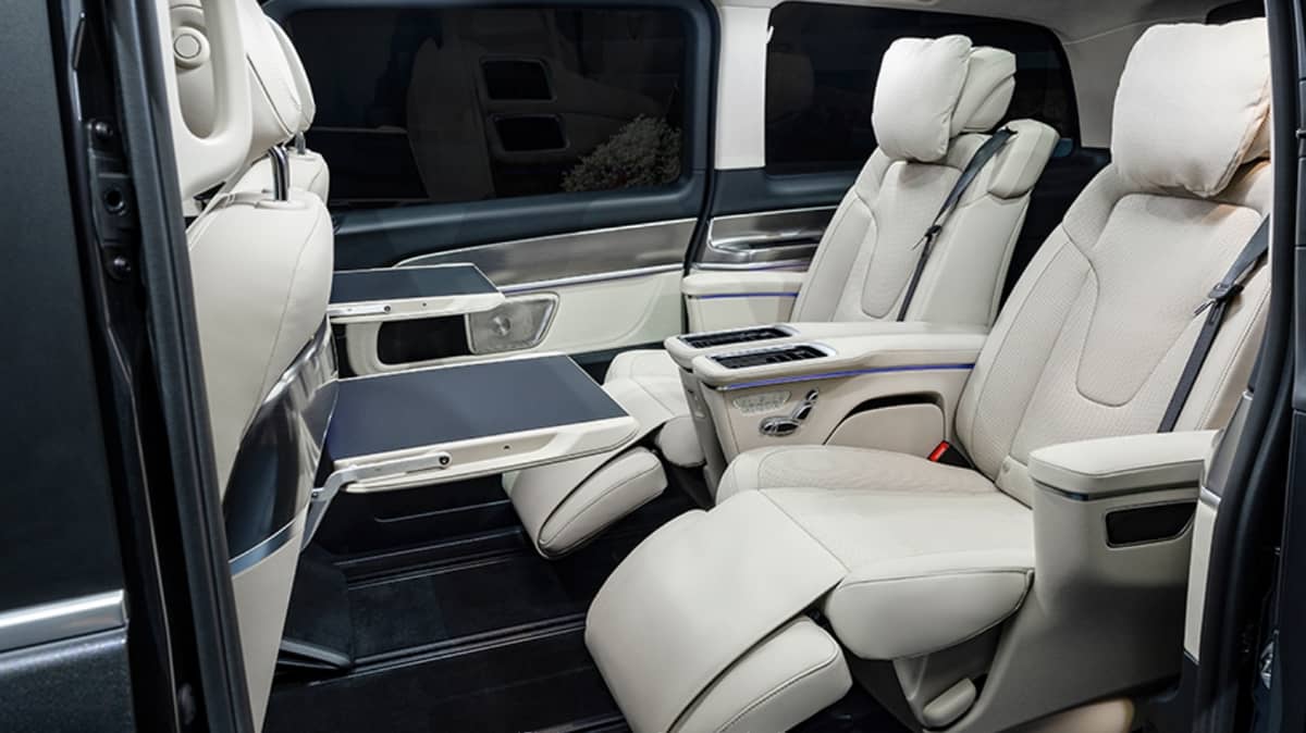 Spacious and flexible cabin with reclining seats and pop-up tables for added comfort.