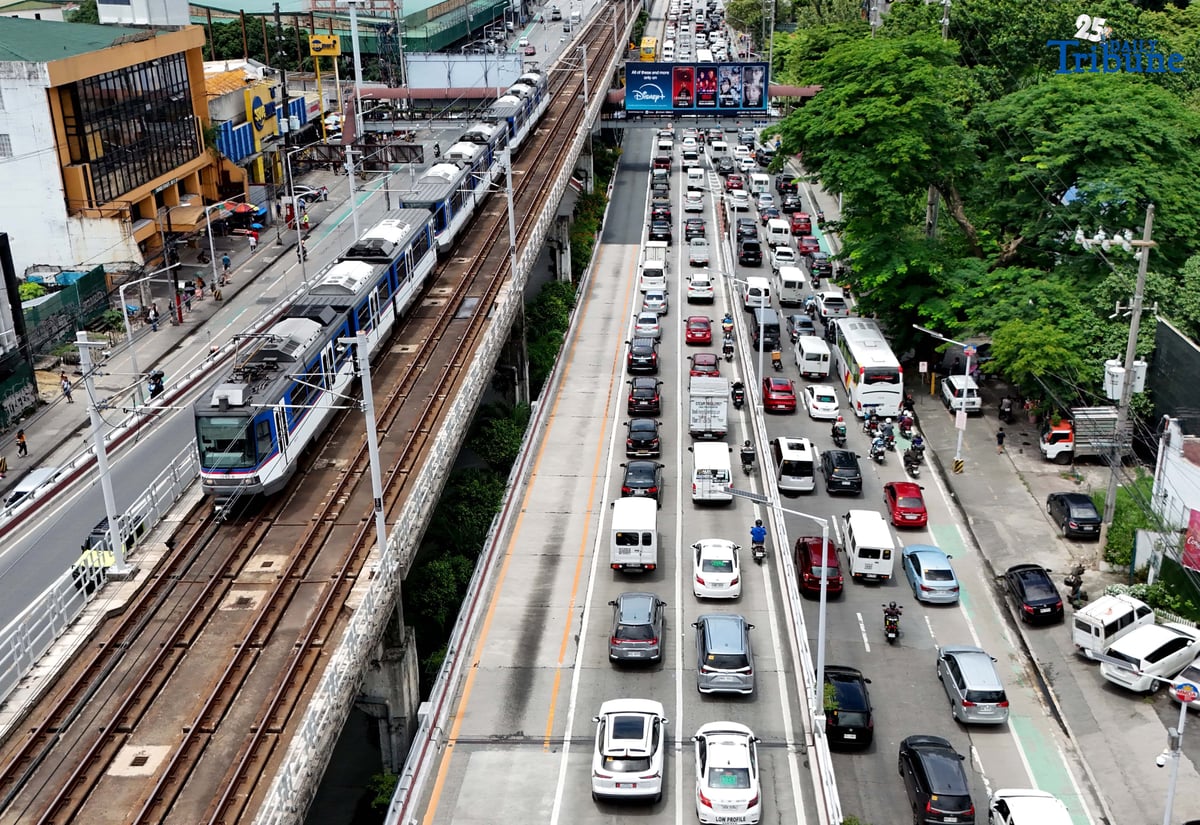 motorist endures heavy southbound traffic along EDSA in Quezon City on Tuesday. The Land Transportation Office earlier announced it has cleared its backlog of license plates for both motorcycles and four-wheel vehicles as of June 2025, in compliance with President Ferdinand Marcos Jr.'s directive to resolve the plate shortage.