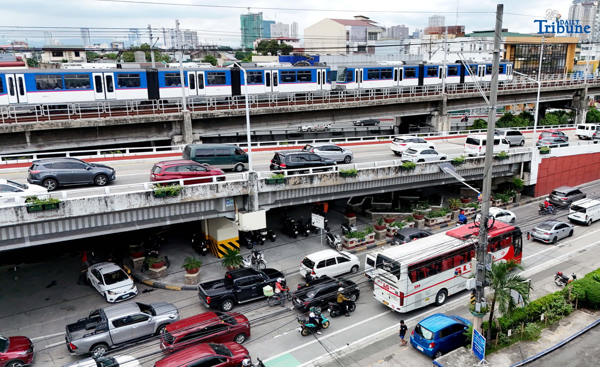 motorist endures heavy southbound traffic along EDSA in Quezon City on Tuesday. The Land Transportation Office earlier announced it has cleared its backlog of license plates for both motorcycles and four-wheel vehicles as of June 2025, in compliance with President Ferdinand Marcos Jr.'s directive to resolve the plate shortage.