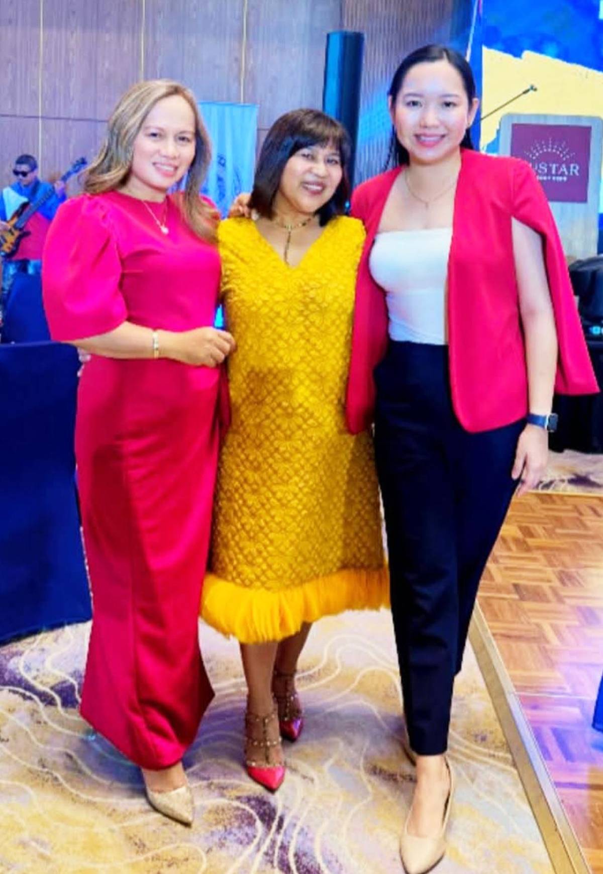 Jenny Robledo Barte, Jonah Lafuente and Shannen Tan, president of Mezzo Hotel.