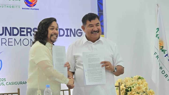 (FILES) Aurora Pacific Economic Zone and Freeport Authority President and CEO Gil Taway IV (left) and Bureau of Fisheries and Aquatic Resources Regional Director Wilfredo Cruz (right) lead the ceremonial signing of a partnership to implement inclusive coastal livelihood projects in Casiguran, Aurora. The agreement includes marine-based facilities and technologies aimed at empowering local communities and advancing sustainable fisheries development.