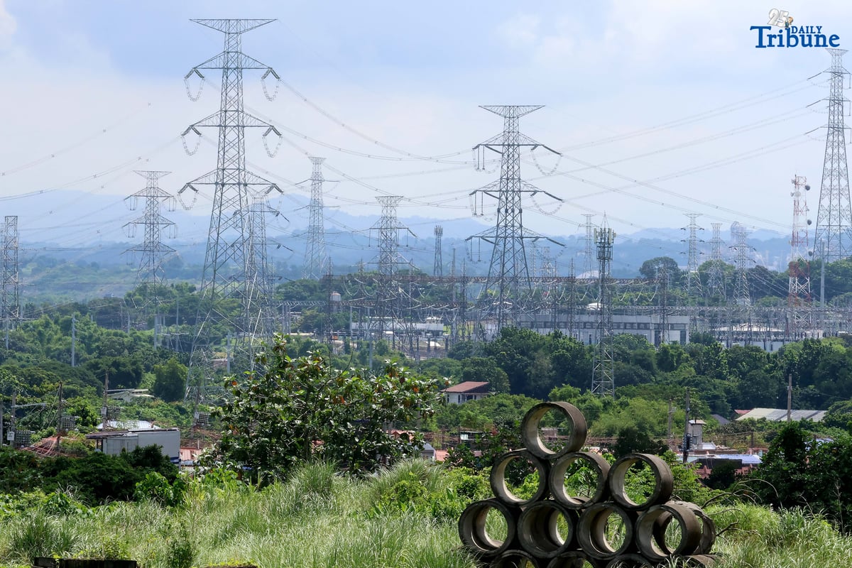 Transmission lines in San Jose del Monte, Bulacan are shown supplying electricity from power plants to substations and end-users on Tuesday. The National Grid Corporation of the Philippines (NGCP) reported that transmission wheeling rates rose slightly in June to ₱0.4611/kWh from ₱0.4593/kWh. NGCP will begin implementing the Energy Regulatory Commission's directive allowing it to recover ₱28.28 billion in under-recoveries from consumers over the next seven years.