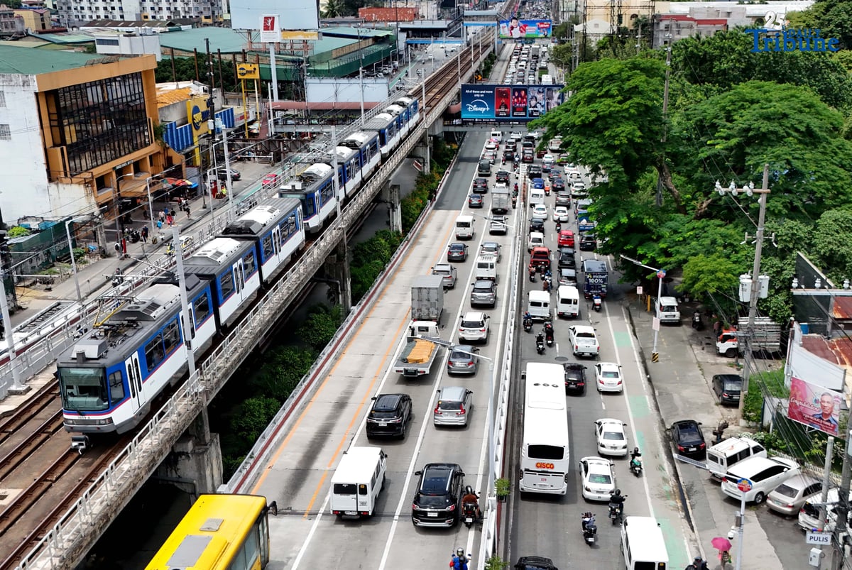 motorist endures heavy southbound traffic along EDSA in Quezon City on Tuesday. The Land Transportation Office earlier announced it has cleared its backlog of license plates for both motorcycles and four-wheel vehicles as of June 2025, in compliance with President Ferdinand Marcos Jr.'s directive to resolve the plate shortage.
