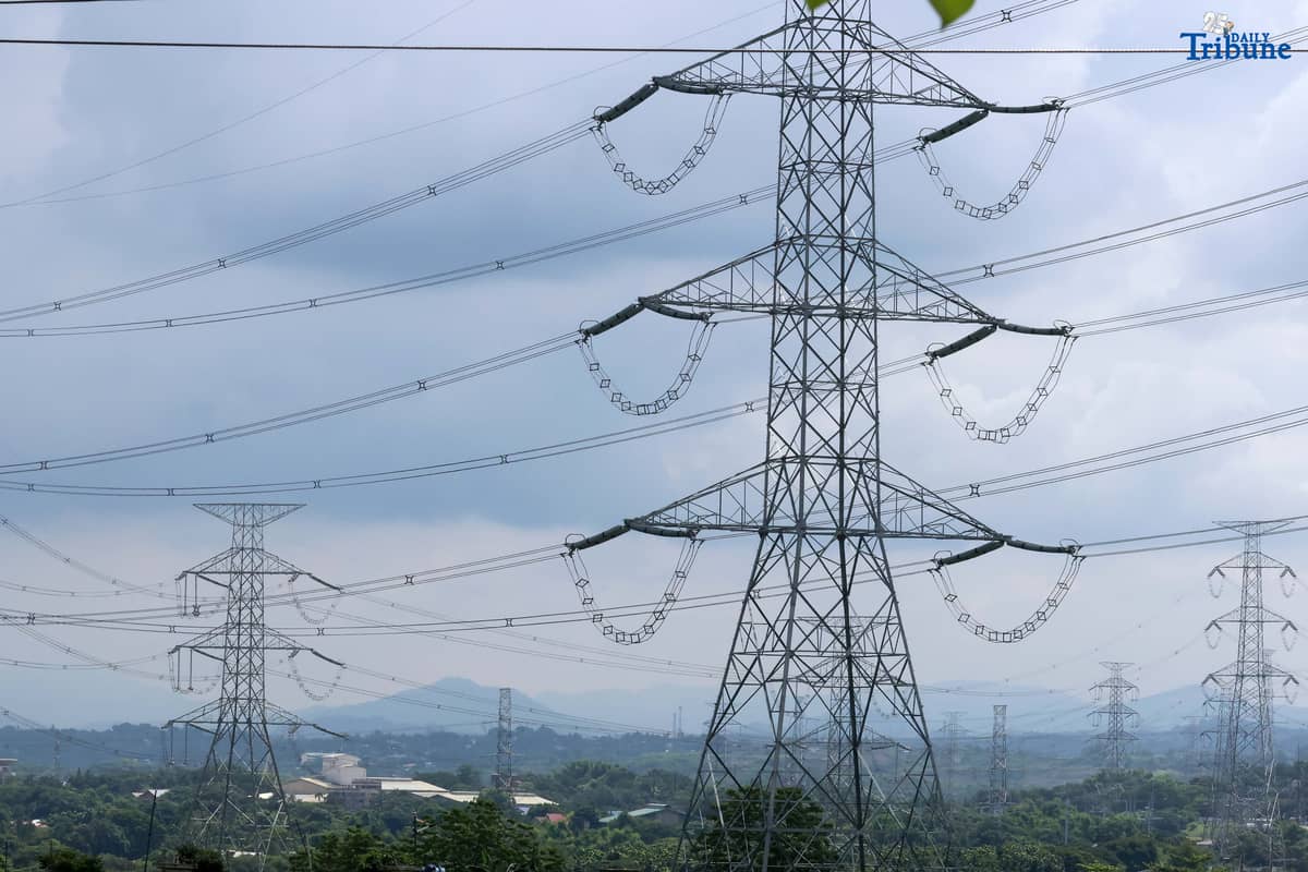 Transmission lines in San Jose del Monte, Bulacan are shown supplying electricity from power plants to substations and end-users on Tuesday. The National Grid Corporation of the Philippines (NGCP) reported that transmission wheeling rates rose slightly in June to ₱0.4611/kWh from ₱0.4593/kWh. NGCP will begin implementing the Energy Regulatory Commission's directive allowing it to recover ₱28.28 billion in under-recoveries from consumers over the next seven years.
