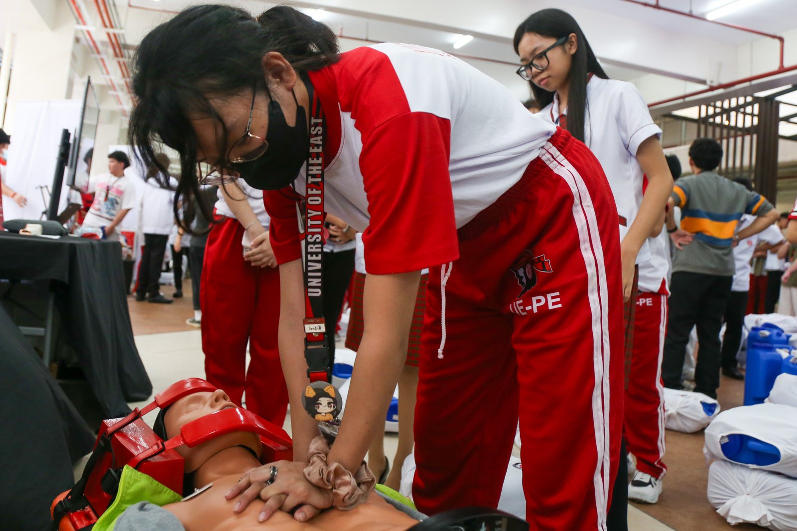 Students from the University East learn how to administer cardiopulmonary resuscitation (CPR) in celebration of National CPR Day (17 July 2025). It also coincides with the anniversary of Republic Act 10871, also known as the Samboy Lim Law, which mandates basic life support training in schools.
