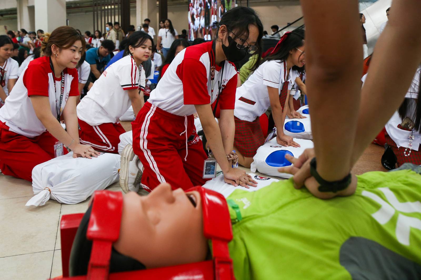 Students from the University East learn how to administer cardiopulmonary resuscitation (CPR) in celebration of National CPR Day (17 July 2025). It also coincides with the anniversary of Republic Act 10871, also known as the Samboy Lim Law, which mandates basic life support training in schools.