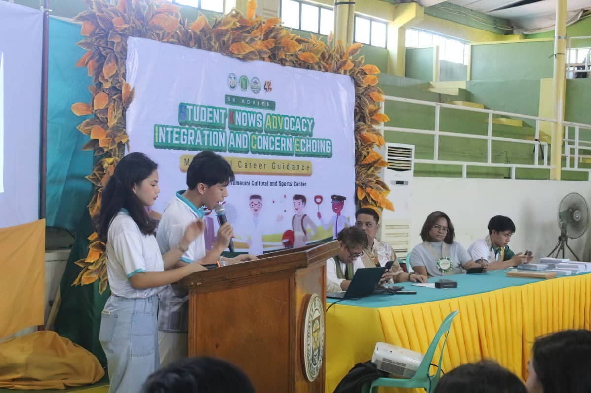 Tadeo serves as co-emcee during a Municipal Career Guidance event held at the Community Center of Tumauini, Isabela.