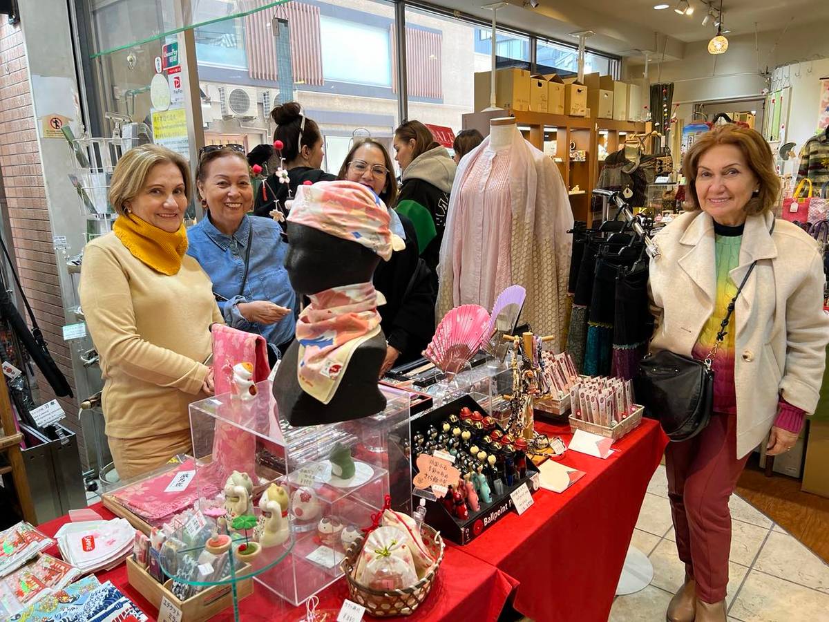Tourists enjoy artisan goods.