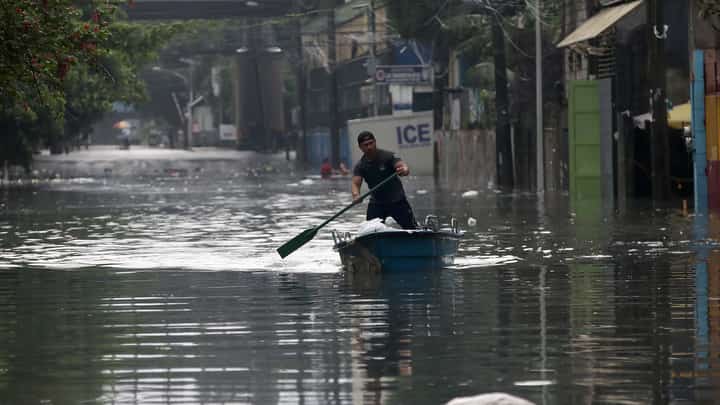 (July, 19 2025) A man uses a small boat to pass through the flooded area along N.S Amoranto St corner Araneta in Quezon City on Saturday, July 19, 2025, due to continuous rains brought by the Habagat intensified by severe tropical storm Crising. Photo/Analy Labor