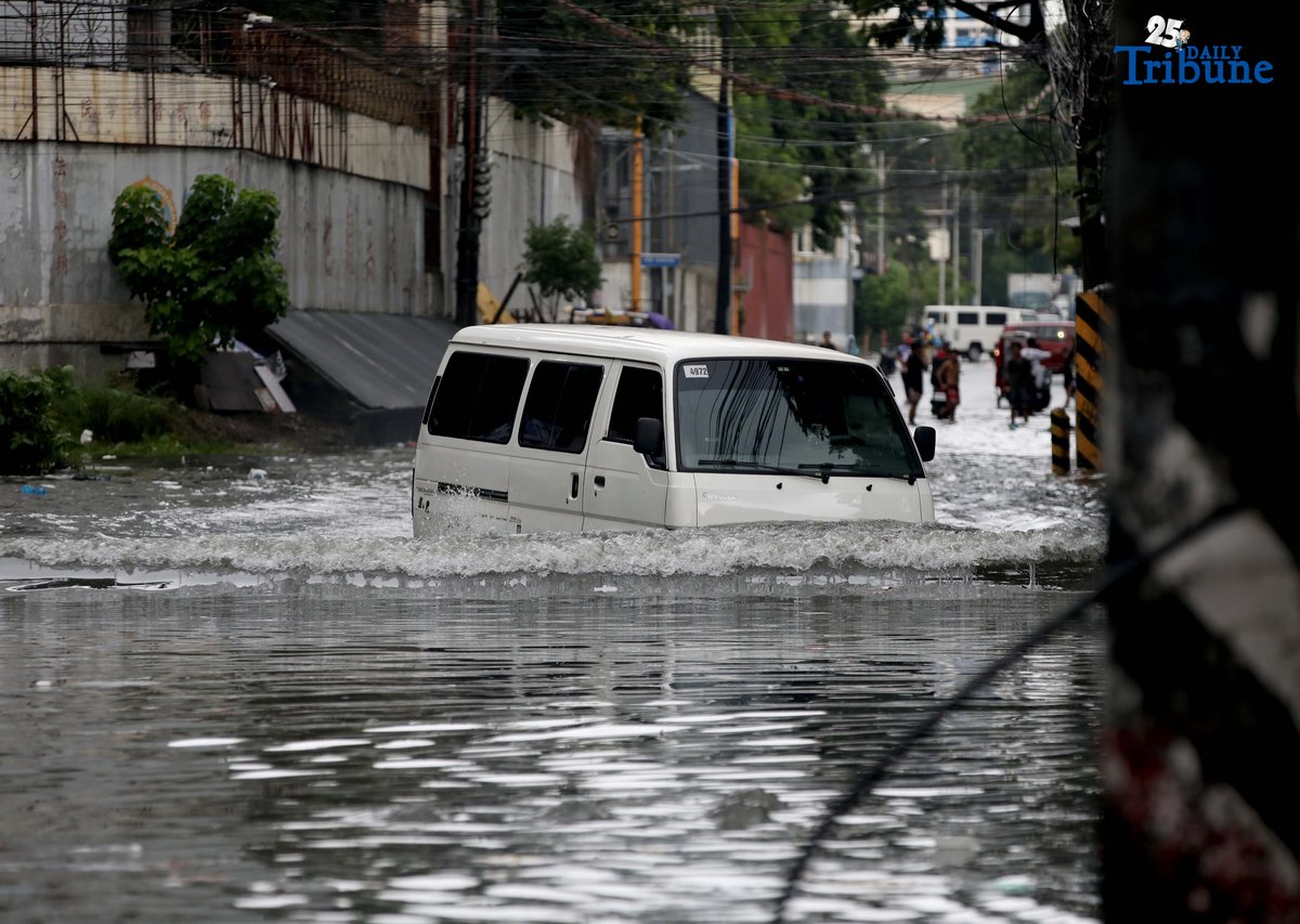 Motorists navigate floodwaters at Maria Clara Street corner Araneta Avenue in Quezon City on Saturday, 19 July 2025, following continuous rains brought by the Habagat and intensified by Severe Tropical Storm Crising.