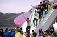 VENEZUELAN migrants who were jailed in El Salvador get off a plane at Simon Bolivar International Airport in Maiquetia, Venezuela on 18 July 2025.