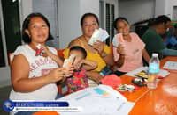 FISHERFOLK show off the assistance they received during the one-day Capability Training on the Development of the Salt Industry Project (DSIP) in Brgy. Dikapanikian, Dingalan, Aurora.
