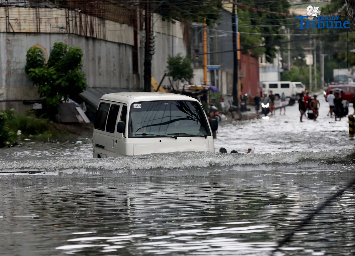 Motorists navigate floodwaters at Maria Clara Street corner Araneta Avenue in Quezon City on Saturday, 19 July 2025, following continuous rains brought by the Habagat and intensified by Severe Tropical Storm Crising.