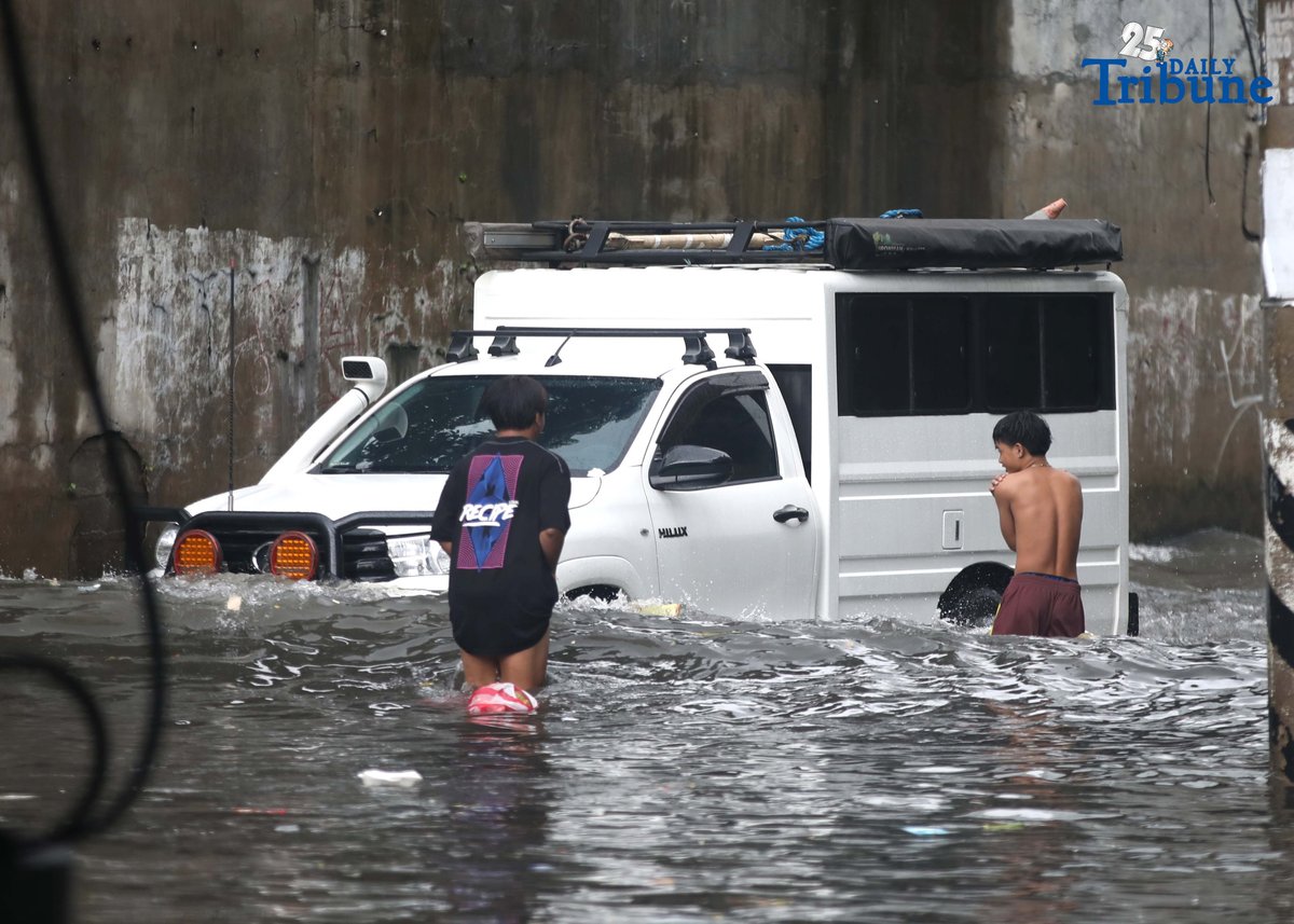Motorists navigate floodwaters at Maria Clara Street corner Araneta Avenue in Quezon City on Saturday, 19 July 2025, following continuous rains brought by the Habagat and intensified by Severe Tropical Storm Crising.