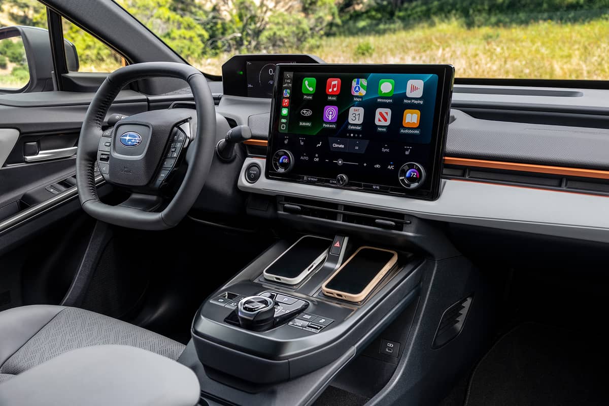 INSIDE the Uncharted: a wide touchscreen, wireless charging pads and a Formula-style steering wheel.