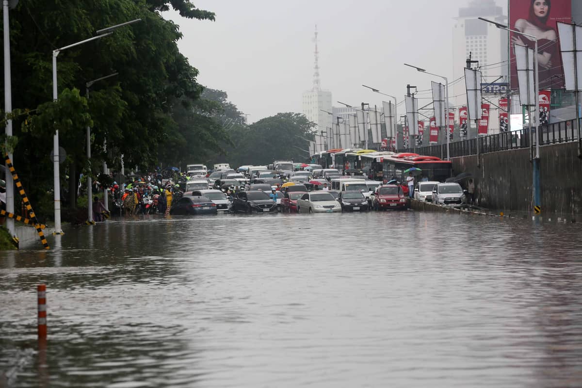 Vehicles are left stranded in front of the Gate 3 of Camp Aguinaldo due to waist deep flood caused by the enhanced southwest monsoon, on Saturday 23 September 2023.