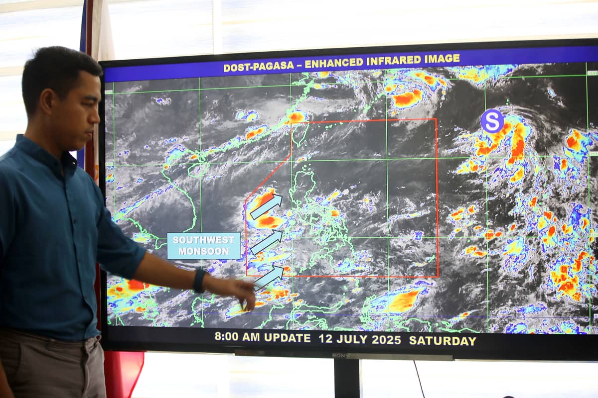 PHILIPPINE Atmospheric, Geophysical and Astronomical Services Administration weather specialist Benison Estareja shows the tropical storm and southwest monsoon  that brings rains and thunderstorms to the country on Saturday, 12 July 2025.