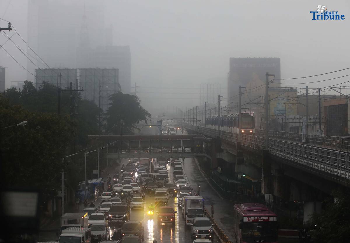 DRENCHED AND BLURRED: Near-zero visibility blankets a street in Quezon City following a heavy downpour on Monday, July 21, 2025. According to PAGASA, a newly formed low-pressure area (LPA) is unlikely to directly impact the country, but has intensified the southwest monsoon (habagat), causing continuous rains over large parts of the Philippines.