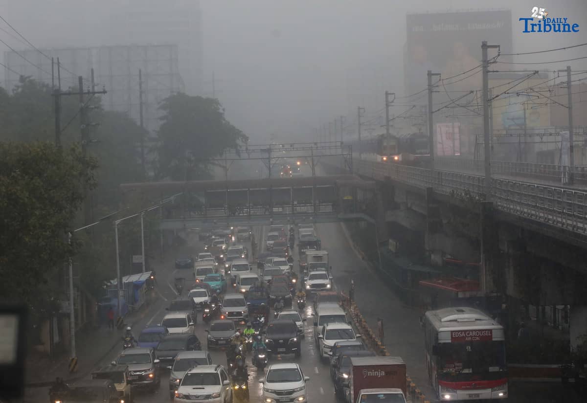 DRENCHED AND BLURRED: Near-zero visibility blankets a street in Quezon City following a heavy downpour on Monday, July 21, 2025. According to PAGASA, a newly formed low-pressure area (LPA) is unlikely to directly impact the country, but has intensified the southwest monsoon (habagat), causing continuous rains over large parts of the Philippines.