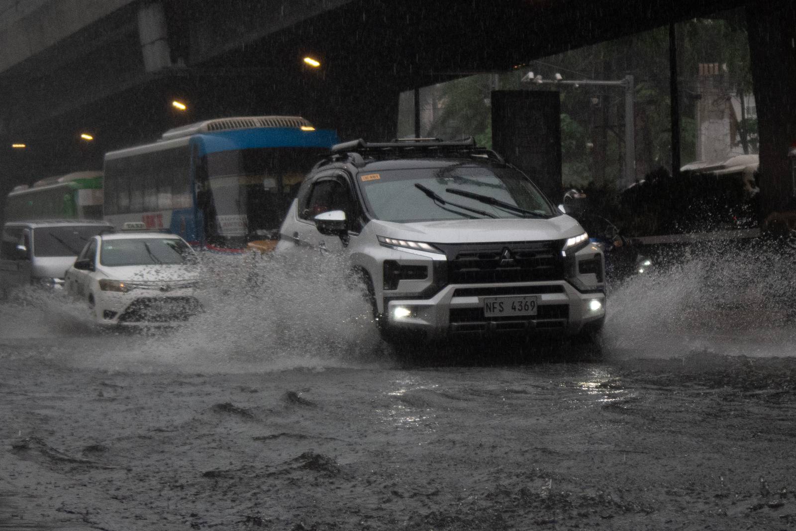 A gutter-deep flood swamps the corner of Taft Avenue and United Nations Avenue in Manila at 9:26 a.m. on Monday, 21 July, as authorities monitor a new low-pressure area within the Philippine Area of Responsibility.