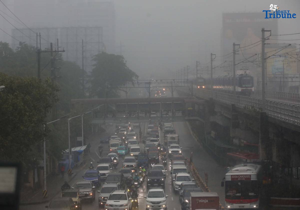 DRENCHED AND BLURRED: Near-zero visibility blankets a street in Quezon City following a heavy downpour on Monday, July 21, 2025. According to PAGASA, a newly formed low-pressure area (LPA) is unlikely to directly impact the country, but has intensified the southwest monsoon (habagat), causing continuous rains over large parts of the Philippines.