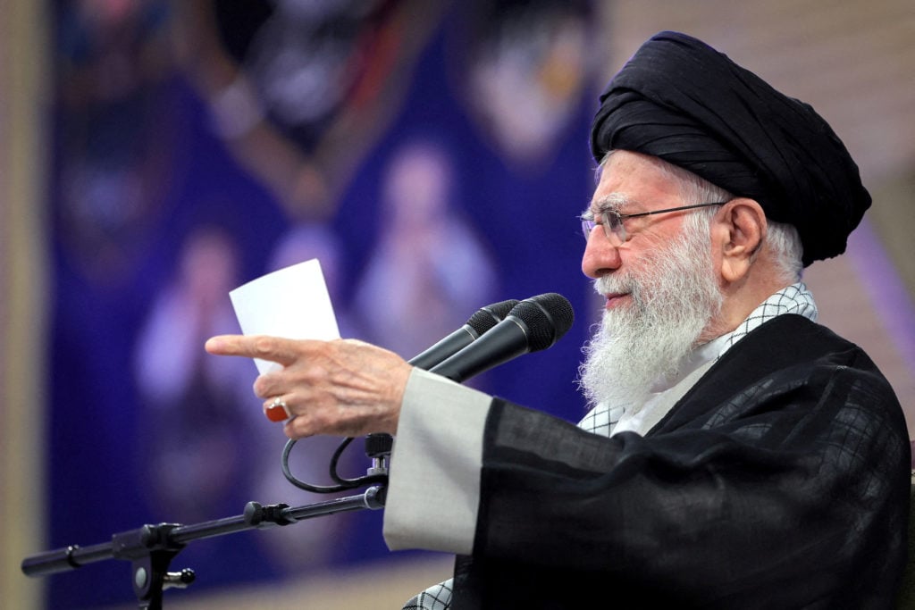Iran fends off sanctions return with E3 talks