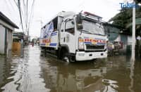 Rescue truck of Obando Bulacan carrying people as they conduct rescue and free ride as well to the stranded people, was seen passing through at the flooded road of Rincon road in Valenzuela City, on Tuesday 22 July 2025.