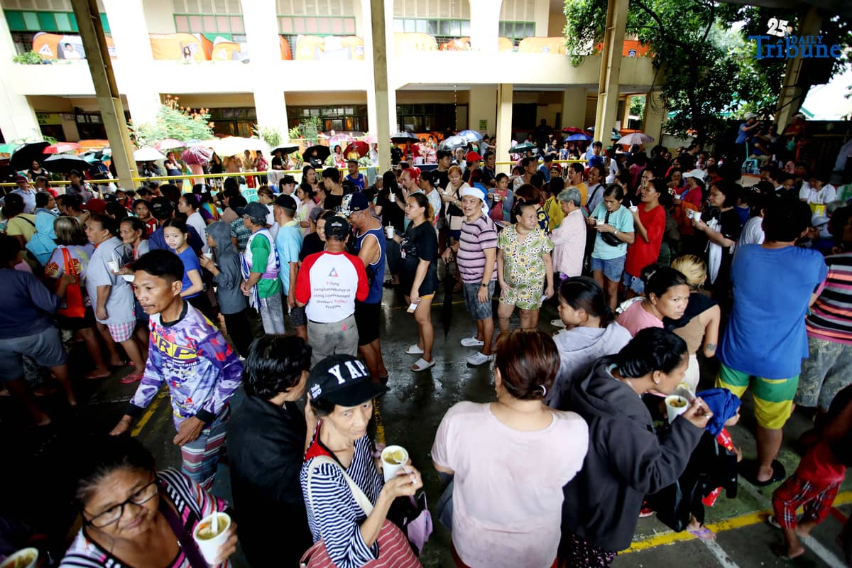 Residents affected by flooding take shelter at Diosdado P. Macapagal Elementary School in Barangay Tatalon, Quezon City. Senator Erwin Tulfo, in partnership with World Vision, led a relief and feeding program for evacuees on Wednesday, July 23, 2025.