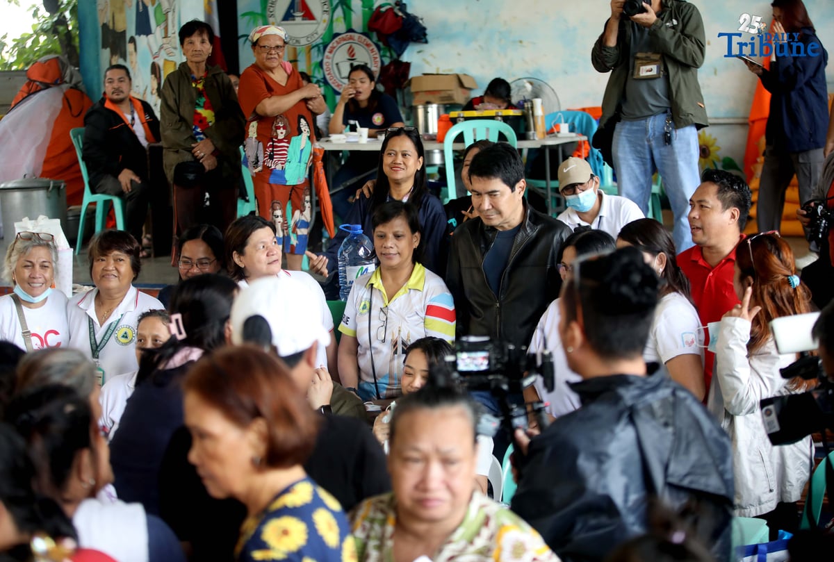 Residents affected by flooding take shelter at Diosdado P. Macapagal Elementary School in Barangay Tatalon, Quezon City. Senator Erwin Tulfo, in partnership with World Vision, led a relief and feeding program for evacuees on Wednesday, July 23, 2025.